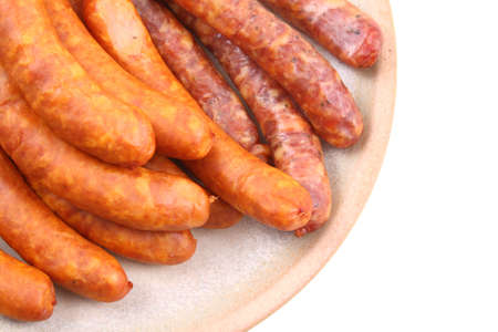 plate of delicious sausages isolated on whiteの写真素材