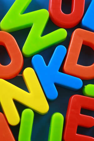 colorful letters on blue board close-upsの写真素材