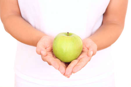 green apple in hands on whiteの写真素材