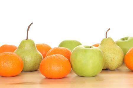 apples pears and tangerines on table - isolated on whiteの写真素材