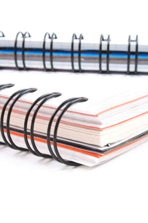 close-ups of two spiral books and isolated on white