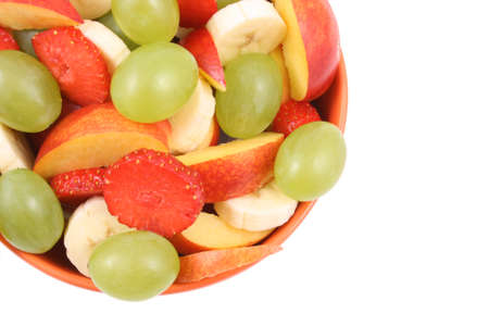 bowl of fruity salad - banana strawberry nectarine and grape - isolated on white