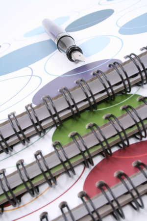 close-ups of three spiral books and pen の写真素材