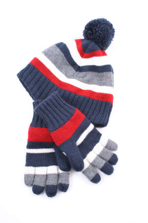 cap and gloves perfect for winter time isolated on whiteの写真素材