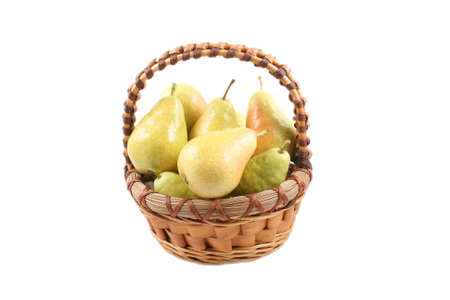 basket full of delicious pears isolated on whiteの写真素材
