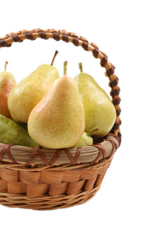 basket full of delicious pears isolated on whiteの写真素材