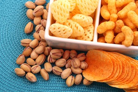 bowl of chips and pistachio - perfect snack for partyの写真素材