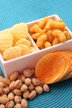 bowl of chips and pistachio - perfect snack for partyの写真素材