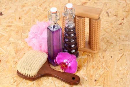 two bottles of cosmetic and orchid flower