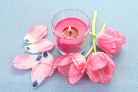 pink candle and spring flowers - aromatherapyの写真素材