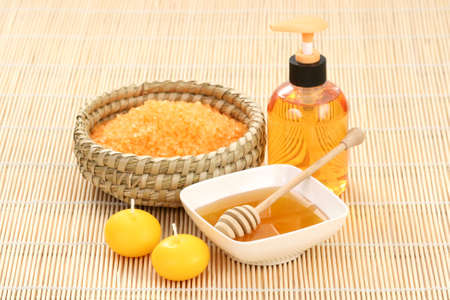 honey and honey bathsalt with candlesの写真素材