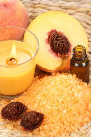 peaches bath with bath salt essential oil and fresh fruitsの写真素材