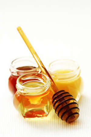 three jars of sweet honey - food and beveragesの写真素材