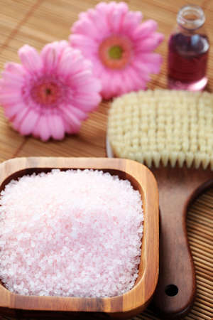 bowl of pink bath salt with flower - beauty treatmentの写真素材