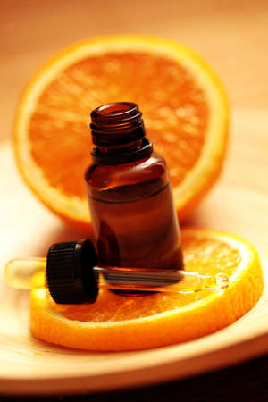 bottle of essential oil from oranges - alternative medicineの写真素材