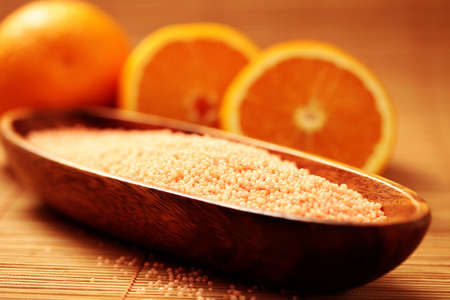 bowl of orange bath caviar with fresh fruits - beauty treatmentの写真素材