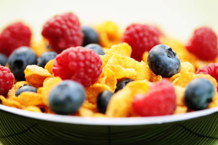 bowl full of corn flakes with fruits - diet and breakfastの写真素材