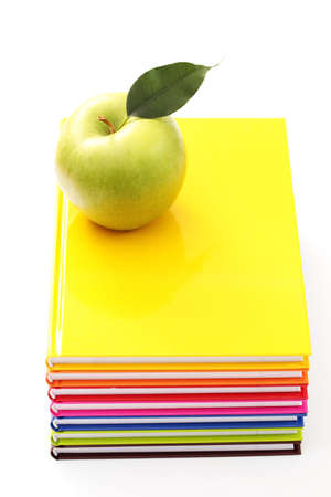 stack of books with green apple - back to schoolの写真素材