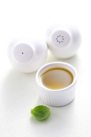bowl of olive oil with salt and pepper - food and drinkの写真素材