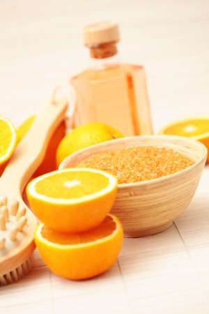 bowl of orange bath salt with fresh fruits - beauty treatmentの写真素材