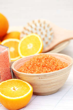 bowl of orange bath salt with fresh fruits - beauty treatmentの写真素材