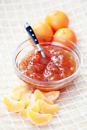 bowl of tangerine jam and fresh fruits - food and drinkの写真素材