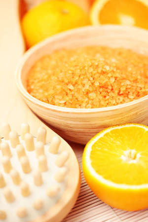 bowl of orange bath salt with fresh fruits - beauty treatmentの写真素材