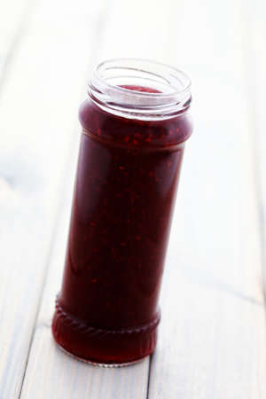 jar of red raspberry jam - food and drink