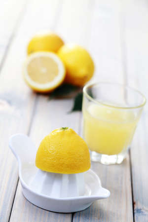 citrus squeezer and fresh lemon juice - food and drink