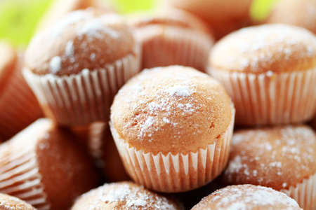 plate full of delicious muffins with sugar - sweet foodの写真素材