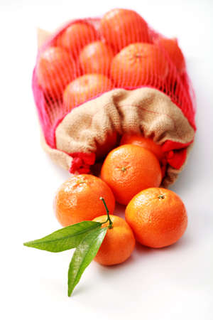 pile of tangerines on white background - fruitsの写真素材