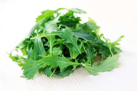 pile of mizuna leaves ready for salad - fruits and vegetablesの写真素材