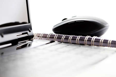 wireless mouse and laptop on desk - office lifeの写真素材
