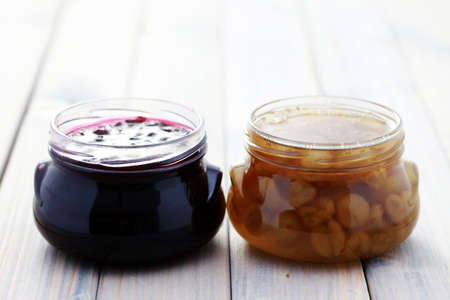 jar of gooseberry and black currant jam - food and drinkの写真素材