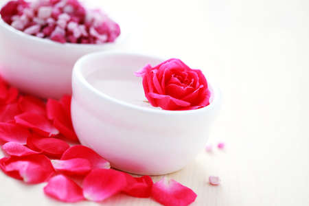 bowl of aromatherapy bath salt and bowl of clean water - beauty treatmentの写真素材