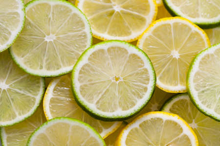 background of fresh sliced lemon and lime fruit - fruits and vegetablesの写真素材