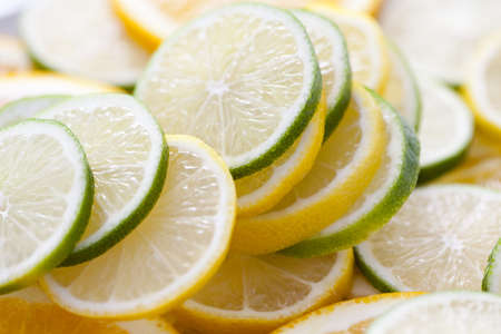 background of fresh sliced lemon and lime fruit - fruits and vegetablesの写真素材