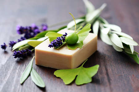 bar of herbal soap with fresh herbs and olives - beauty treatmentの写真素材