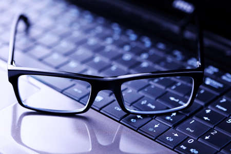 close-ups on glasses on laptop - office lifeの写真素材