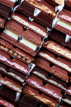 stack of delicious and various chocolates  - sweet foodの写真素材