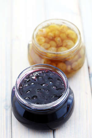 jar of gooseberry and black currant jam - food and drink