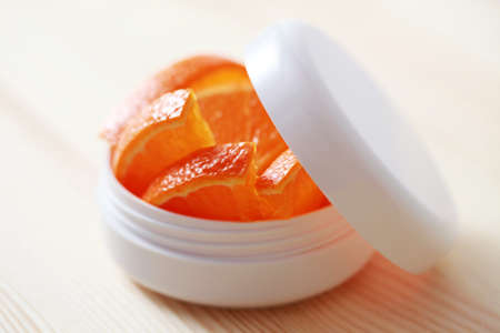 box of natural cream with orange fruit - beauty treatmentの写真素材