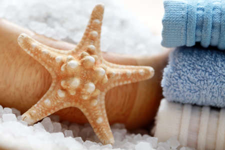 bowl of aromatic bath salt and pile of towels - beauty treatment /shallow dof/の写真素材