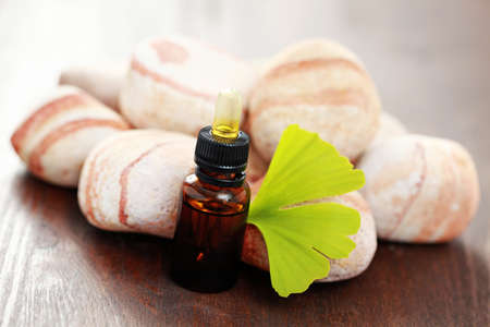 bottle of ginko essential oil with fresh ginko - beauty treatmentの写真素材