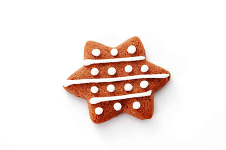 gingerbread star on white background - sweet foodの写真素材