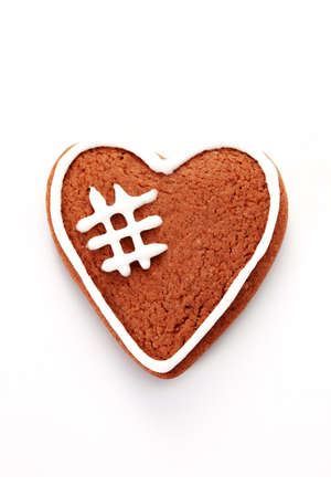 gingerbread heart on white background - sweet foodの写真素材