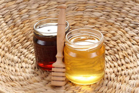 two jars of sweet honey - nutrition conceptの写真素材