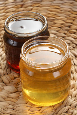 two jars of sweet honey - nutrition conceptの写真素材