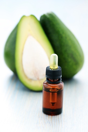 bottle of avocado essential oil with fresh fruit - beauty treatmentの写真素材