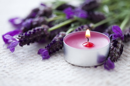candle with lavender flowersの写真素材